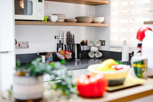 a kitchen counter with a counter top with a counter top at Daniel's Apt - Magical Views in Tsadha