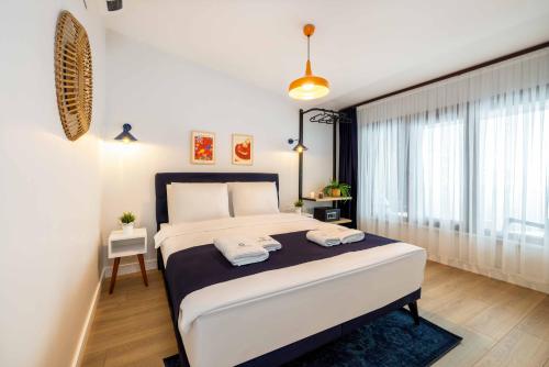 a bedroom with a bed with two towels on it at Monnas Suite in Istanbul
