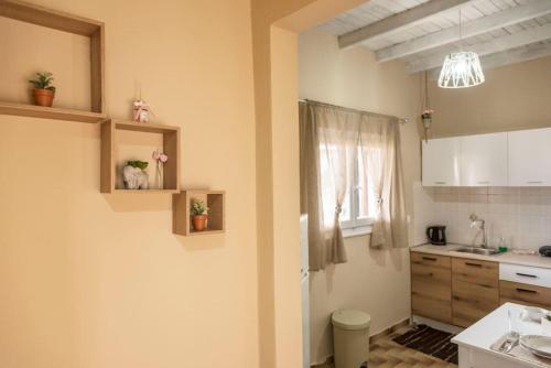 a small kitchen with a sink and a window at Lydia's House in Corfu Town