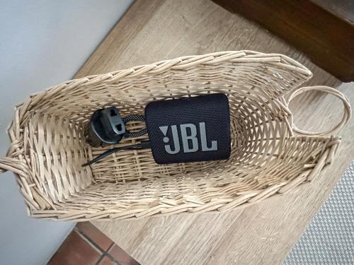 a wicker basket with a cell phone in it at Fisherman House by iCasamia in Antibes