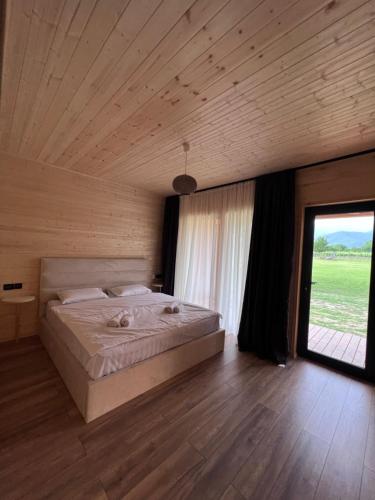 Postel nebo postele na pokoji v ubytování Chubini Winery & Cabins