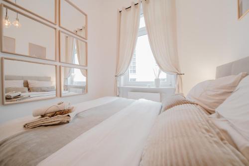 Ένα ή περισσότερα κρεβάτια σε δωμάτιο στο LLR Design Apartment - Sienna Beige im Zentrum von Koblenz