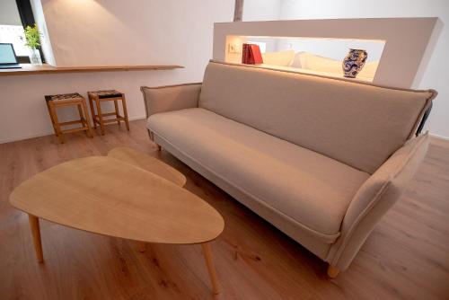 a living room with a couch and a table at Casa del Médico Hotel Boutique in Alcázar de San Juan
