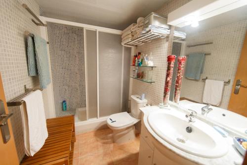 a bathroom with a sink and a toilet at Salicornia apartament in L'Eucaliptus