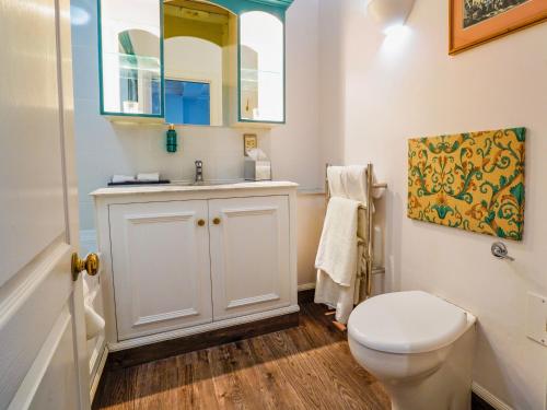 a bathroom with a white toilet and a sink at Villiers Hotel in Buckingham