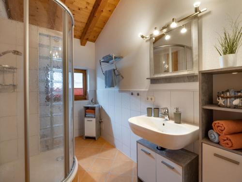 a bathroom with a sink and a shower at Ferienwohnung Eisenmann in Bad Häring