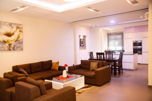 a living room with a couch and a table at IMOLEASE Kouessi Menontin in Cotonou