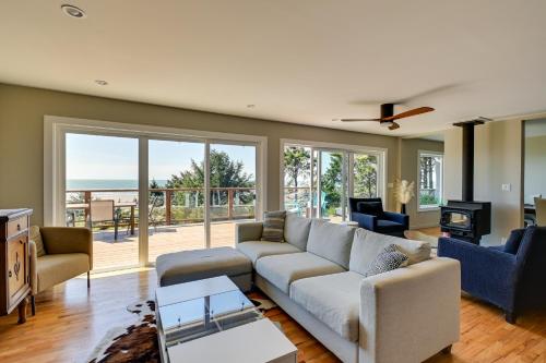 a living room with a couch and a table at Moclips Home with Hot Tub and Stunning Beach Views! in Moclips