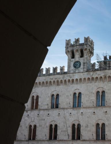a building with a clock tower on top of it at Chiavari Beach in Chiavari
