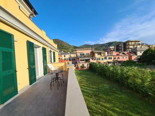 a balcony with a table and chairs on a building at Santa Caterina in Levanto