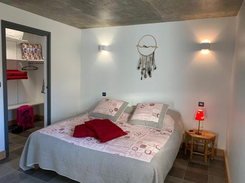 a bedroom with a bed in a room at Domaine de la Rue de la Tour in Valsonne