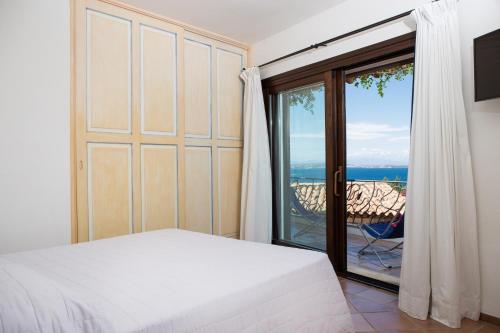 Katil atau katil-katil dalam bilik di [CALA DEI GINEPRI] Vista Mare, Giardino, Wifi
