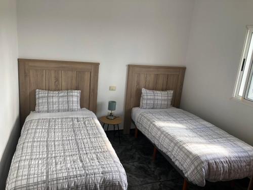 Cama ou camas em um quarto em Pico Lomito House