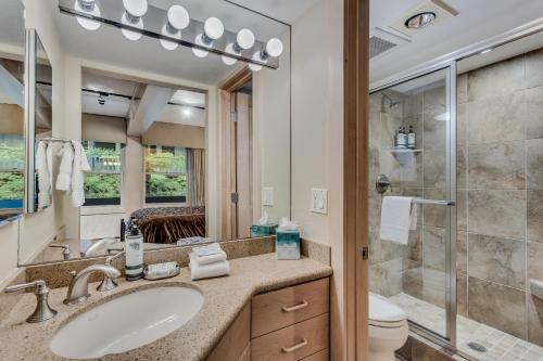 a bathroom with a sink and a shower at Interlude Condominiums 2-Bedroom Unit 202 in Snowmass Village