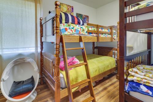 a room with two bunk beds and a mirror at Fire Pit, Kayak and Gas Grill Pocono Lake Home! in Pocono Lake