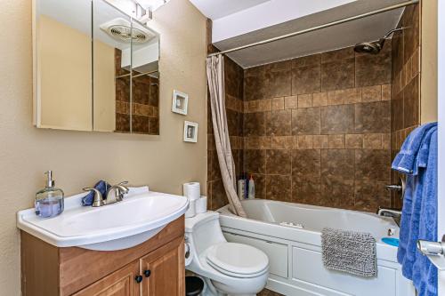 a bathroom with a sink and a toilet and a tub at Ocean View, 2 Baths, 2 Bedrooms, No Stairs, Best Area, WD, Jacuzzi Bath, Balcony, View, 925sf in Tacoma