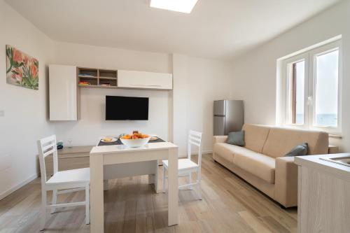 a living room with a couch and a table at Suite N12 - Luxury Apartment in Bari