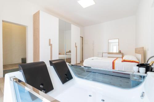 a bedroom with a bed and a swimming pool at Suite N12 - Luxury Apartment in Bari
