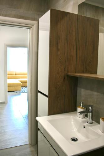 a kitchen with a sink and a refrigerator at Apartments Antea in Trogir
