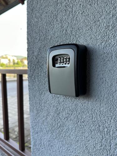 a remote control on the side of a wall at U Bocmana s výhledem na zámek a Labe in Děčín