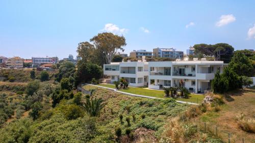 an aerial view of a white house on a hill at Island Hills in Rhodes Town