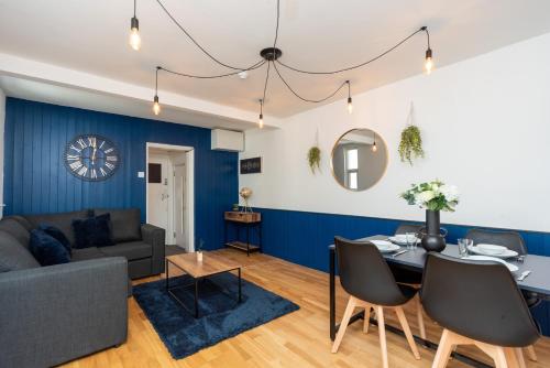a living room with a couch and a table at Free Parking Coastal Modern One Bedroom Apartment in Great Yarmouth
