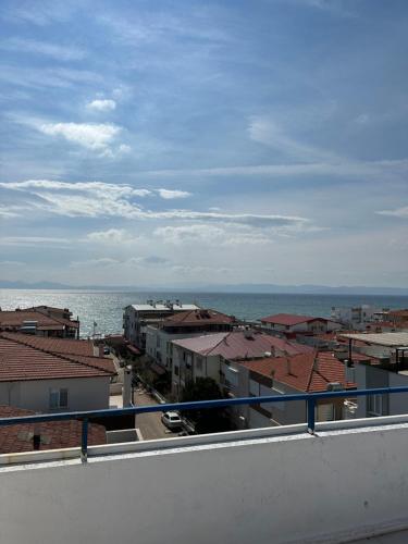 a view of the ocean from a balcony at Beyaz Saray Apart Otel in Ayvalık