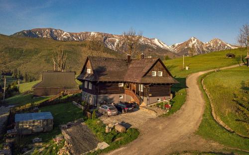 an aerial view of a house in the mountains at Drevenica Spiaci Goral in Ždiar