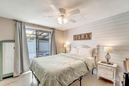 a bedroom with a bed and a ceiling fan at Ocean View Villa in Holmes Beach