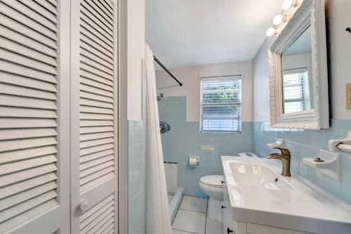 a bathroom with a toilet and a sink and a tub at Ocean View Villa in Holmes Beach