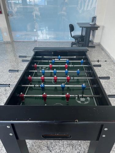 a pool table with balls on it in a room at Águas da Serra in Rio Quente