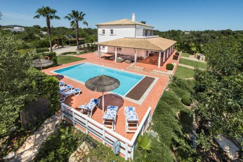 an aerial view of a house with a swimming pool at VILLA MONTE PARDAL w/ Heated Pool in Natural Park in Moncarapacho