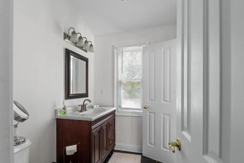 a bathroom with a sink and a window at Beach House in Amagansett