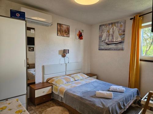 Postel nebo postele na pokoji v ubytování Apartments Ivan