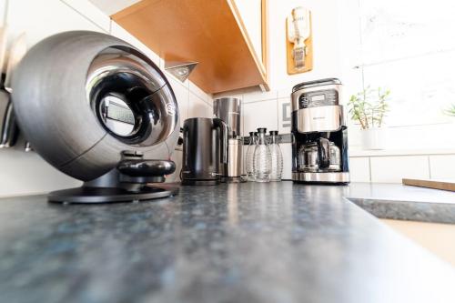 a kitchen counter with a mixer on a counter top at Einzigartiger Panoramablick zur Schwäbische Alb in Altenriet