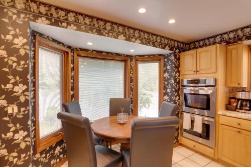 a dining room with a wooden table and chairs at Waterfront Luna Pier Home 14 Mi to Downtown Toledo in Erie