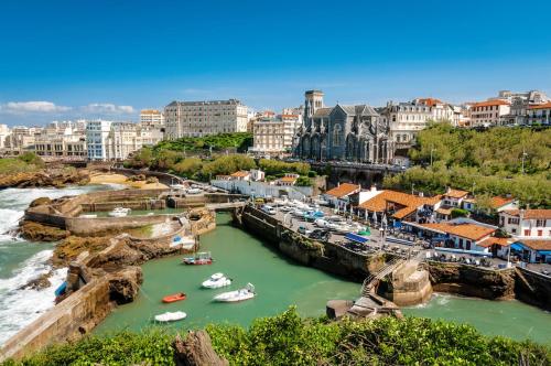 a view of a river with boats in a harbor at Gite Choroby in Bardos