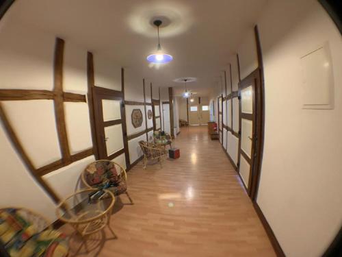 a hallway with tables and chairs in a building at Gutshausferien im Ostseehinterland in Thelkow
