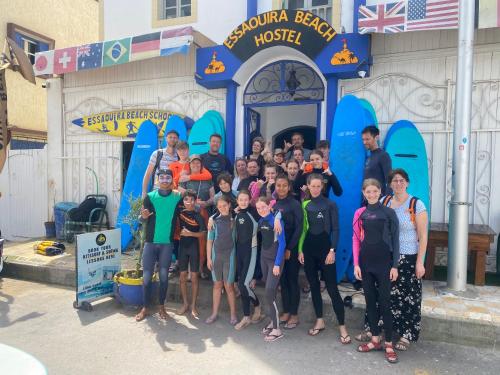 a group of people posing for a picture in front of a water park at Essaouira Beach Hostel in Essaouira