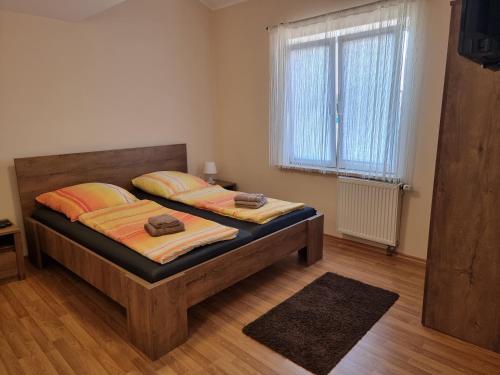a bedroom with two beds and a window at Apartments Lean in Poreč