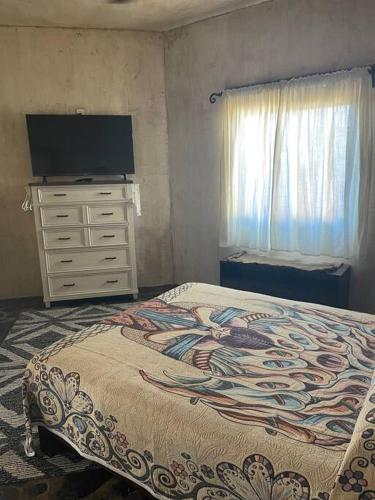 Postel nebo postele na pokoji v ubytování Casa Mi Pueblito