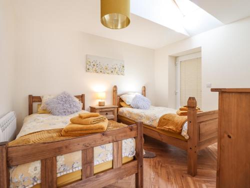 מיטה או מיטות בחדר ב-Varley Villa