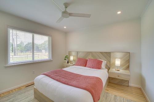 a bedroom with a large bed and a window at Well-Appointed Tulsa Home with Fire Pit and Patio! in Tulsa