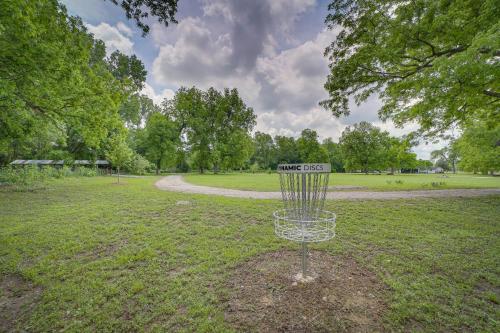 a frisbee golf goal in the middle of a field at Well-Appointed Tulsa Home with Fire Pit and Patio! in Tulsa