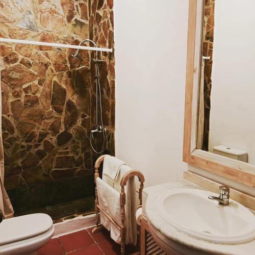a bathroom with a sink and a shower at Herdade Do Rio Torto in Portel