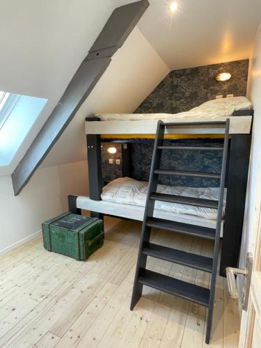 a room with bunk beds in a attic at La Ferme du Raz Blanchard in Auderville
