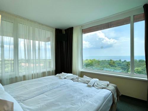 Postel nebo postele na pokoji v ubytování BSA Gradina Hotel & Aquapark - All Inclusive