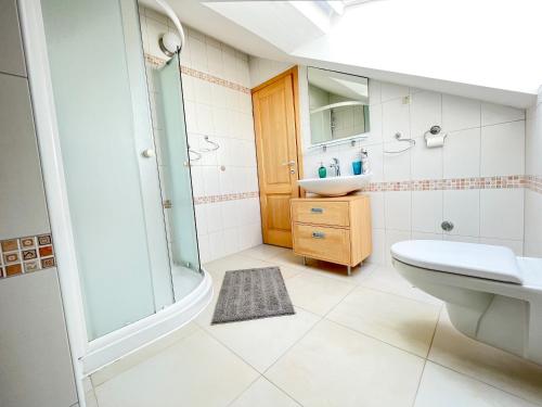 a bathroom with a tub and a sink and a toilet at Mandre Island Pag in Mandre