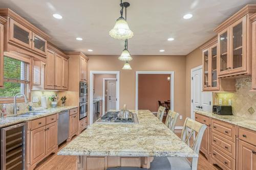 a kitchen with a large island with a counter top at Paradise at Sunset Cove in Moneta