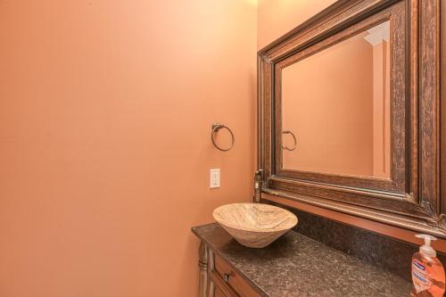 a bathroom with a mirror and a sink at Paradise at Sunset Cove in Moneta